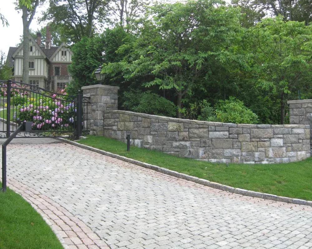 Stone wall and cobblestone driveway entry on a Bedford NY estate