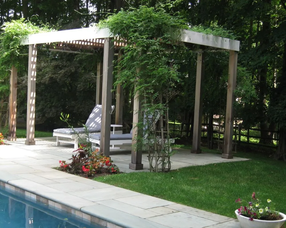 Custom wood pergola and poolside patio design in Pound Ridge NY